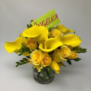 Yellow roses in a glass container